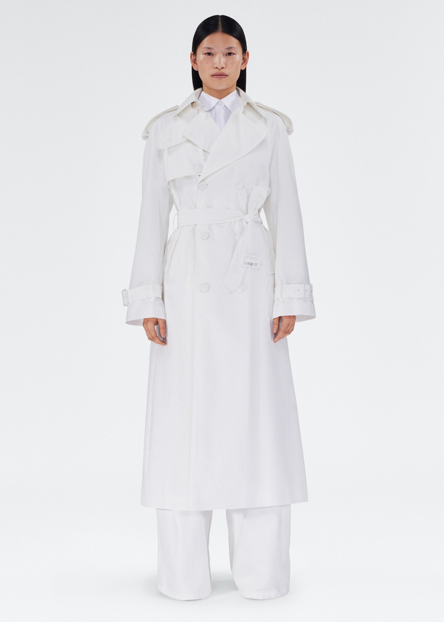 front view of the model wearing the monte trench by adam lippes in compact cotton poplin in white