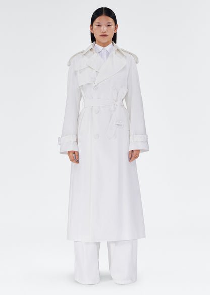 front view of the model wearing the monte trench by adam lippes in compact cotton poplin in white