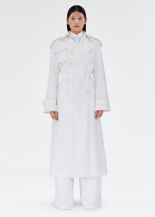 front view of the model wearing the monte trench by adam lippes in compact cotton poplin in white