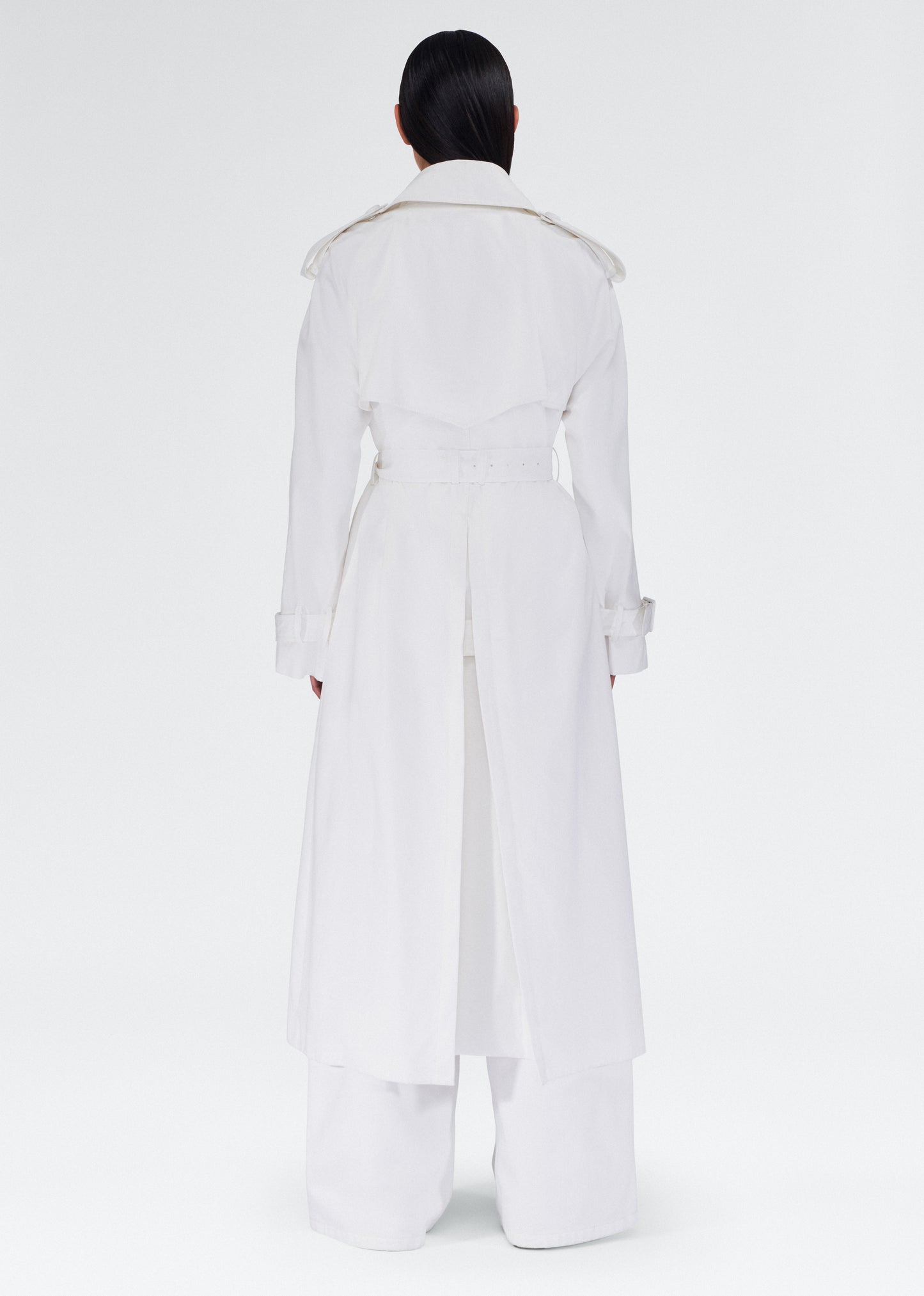 back view of the model wearing the monte trench by adam lippes in compact cotton poplin in white