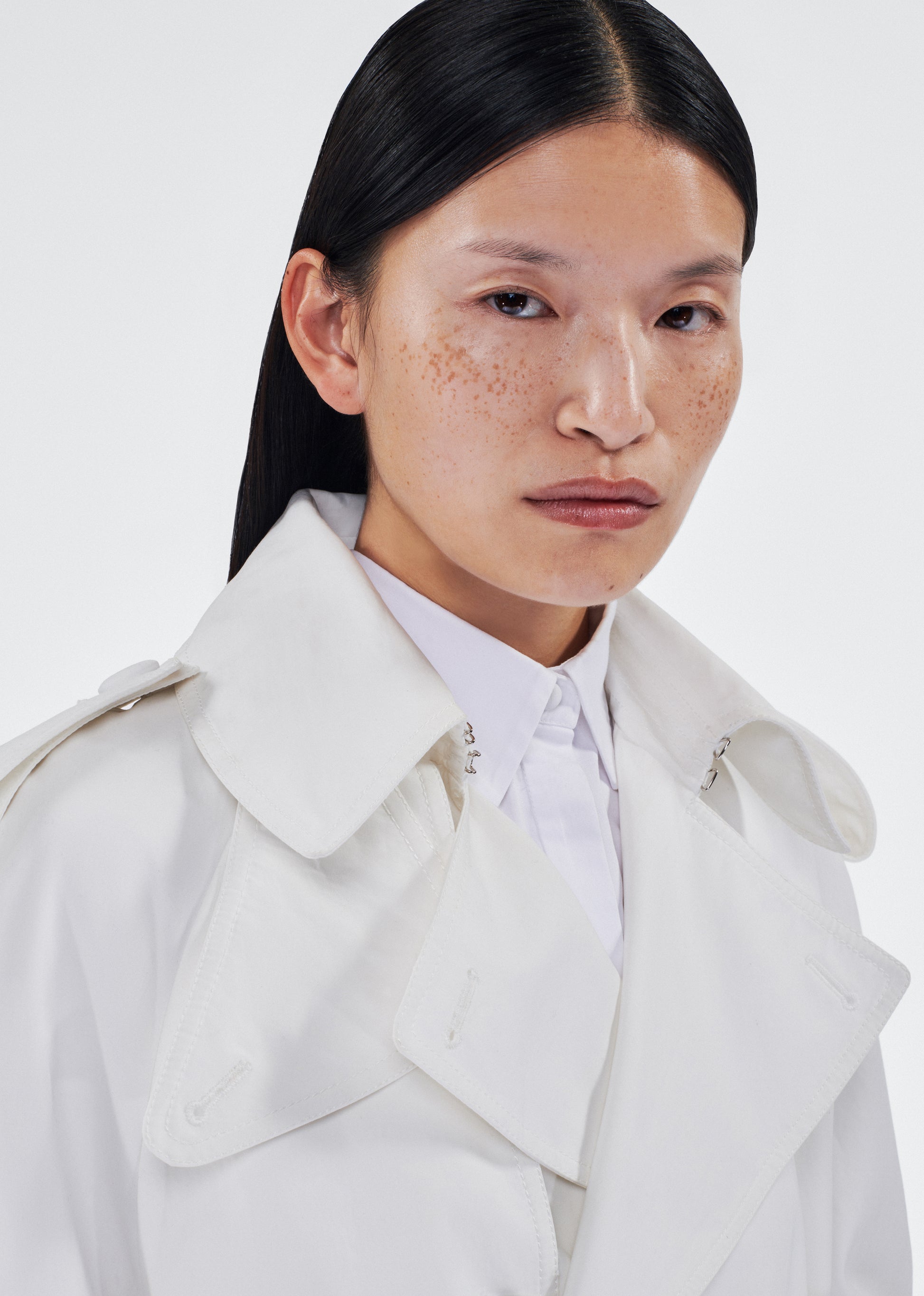 model wearing the monte trench by adam lippes in compact cotton poplin in white