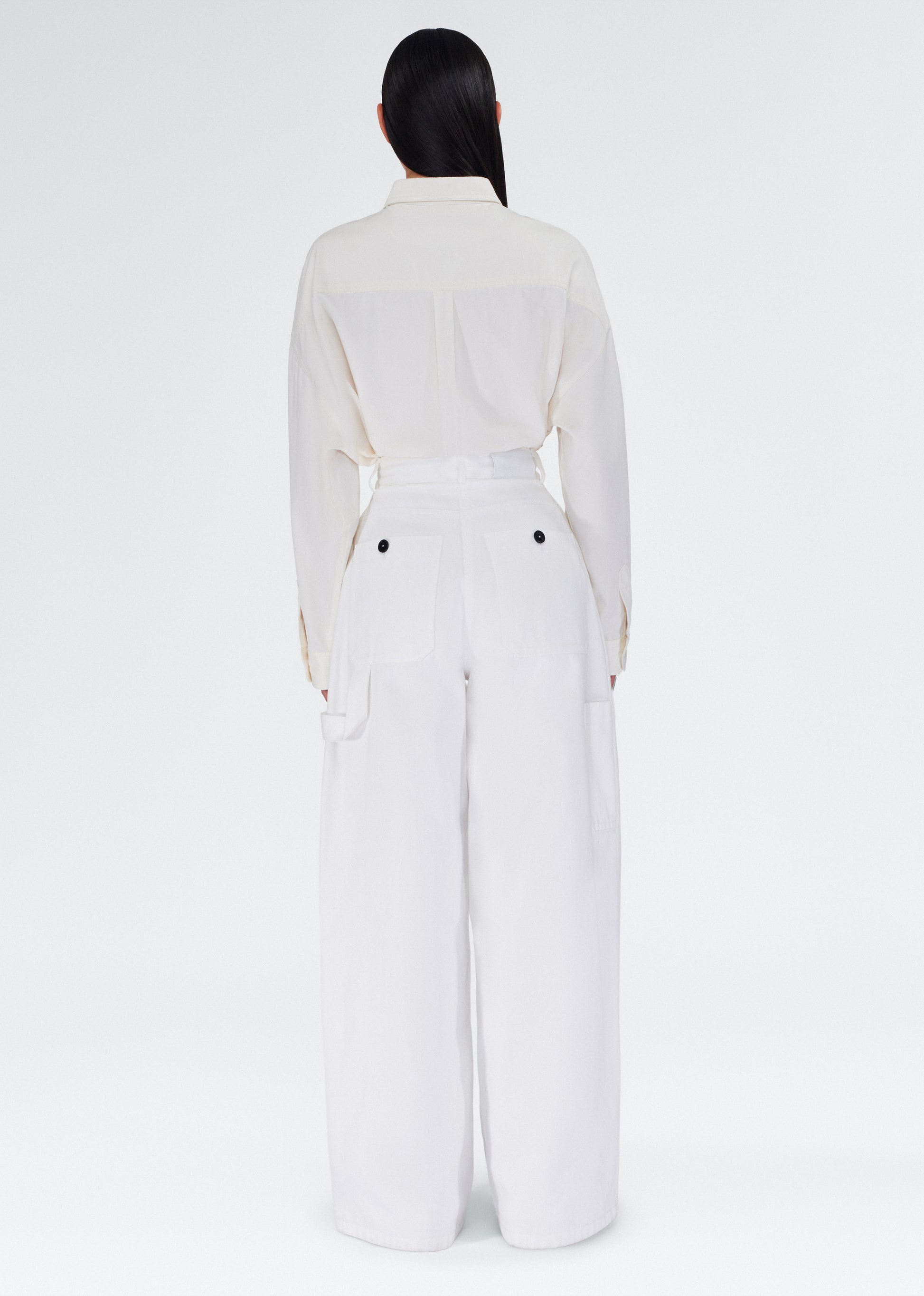 Back of model wearing the Jasper Pant in White Denim