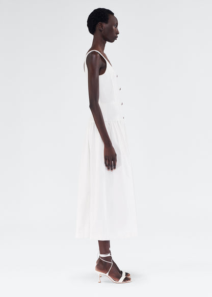 Side of model wearing the Cassie Dress in White Denim