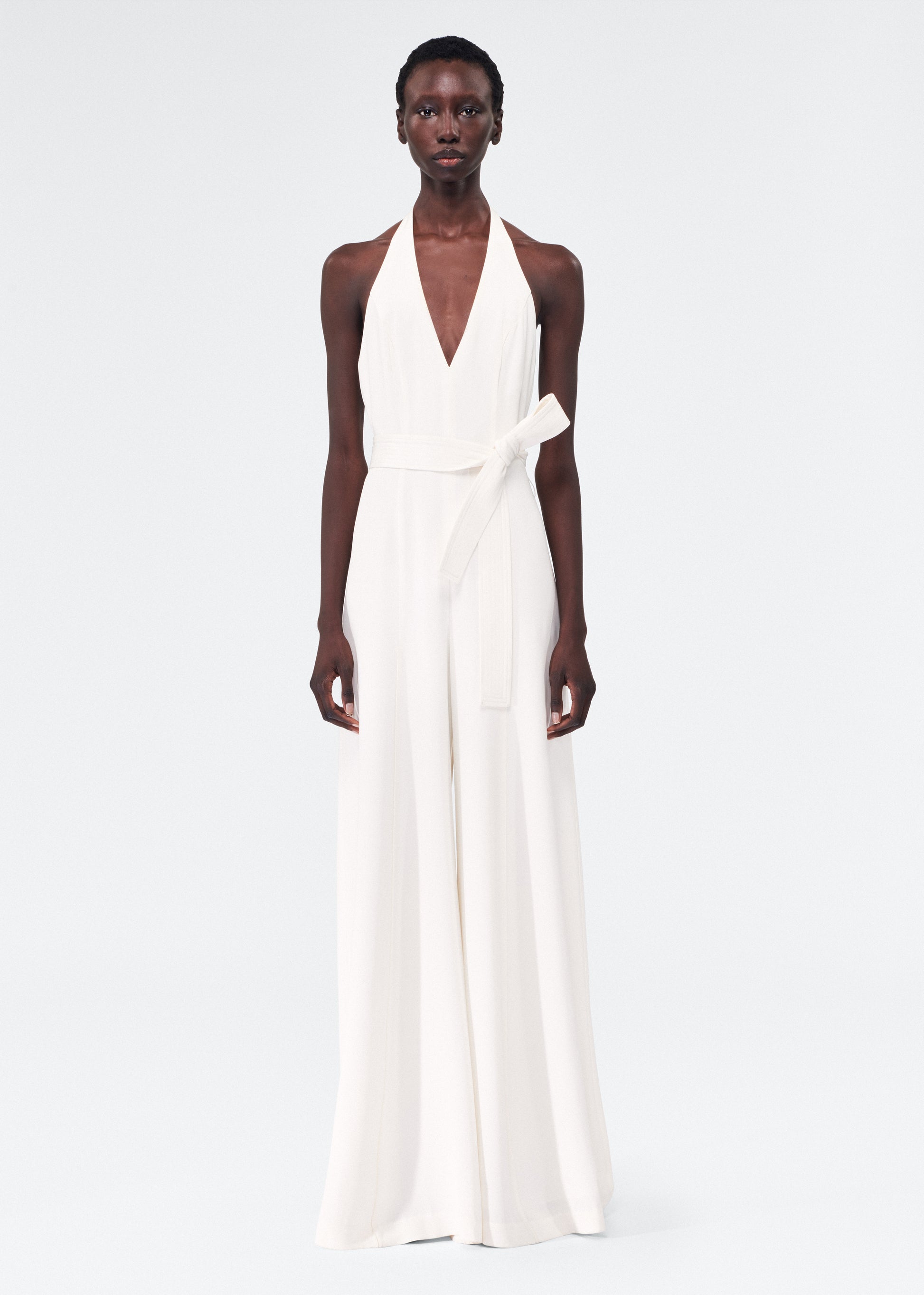 model wearing the adam lippes gaia jumpsuit in silk crepe in ivory