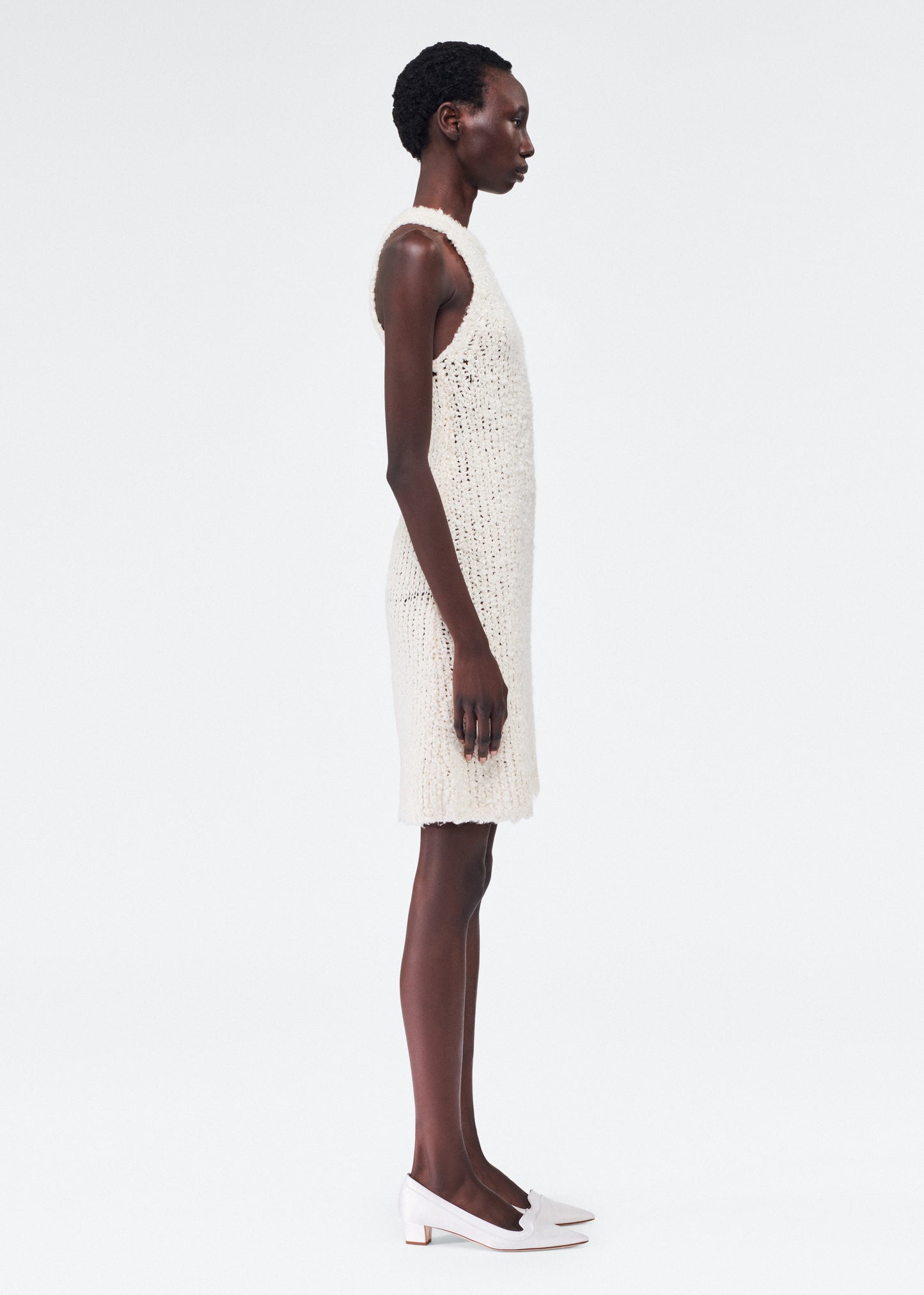 Side of model wearing the Renata Dress in Mulberry Silk in Ivory