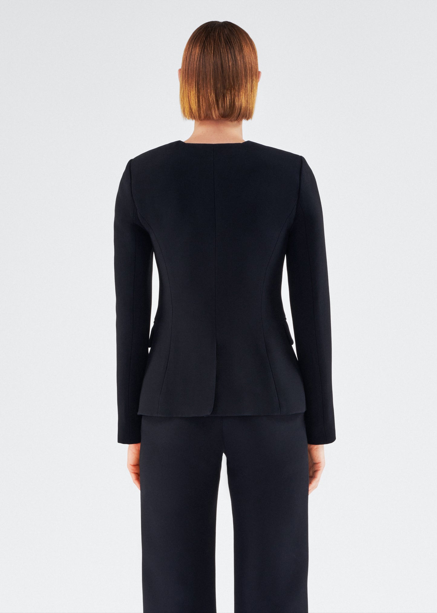 Back of model wearing the Marin Jacket in Silk Wool in Black