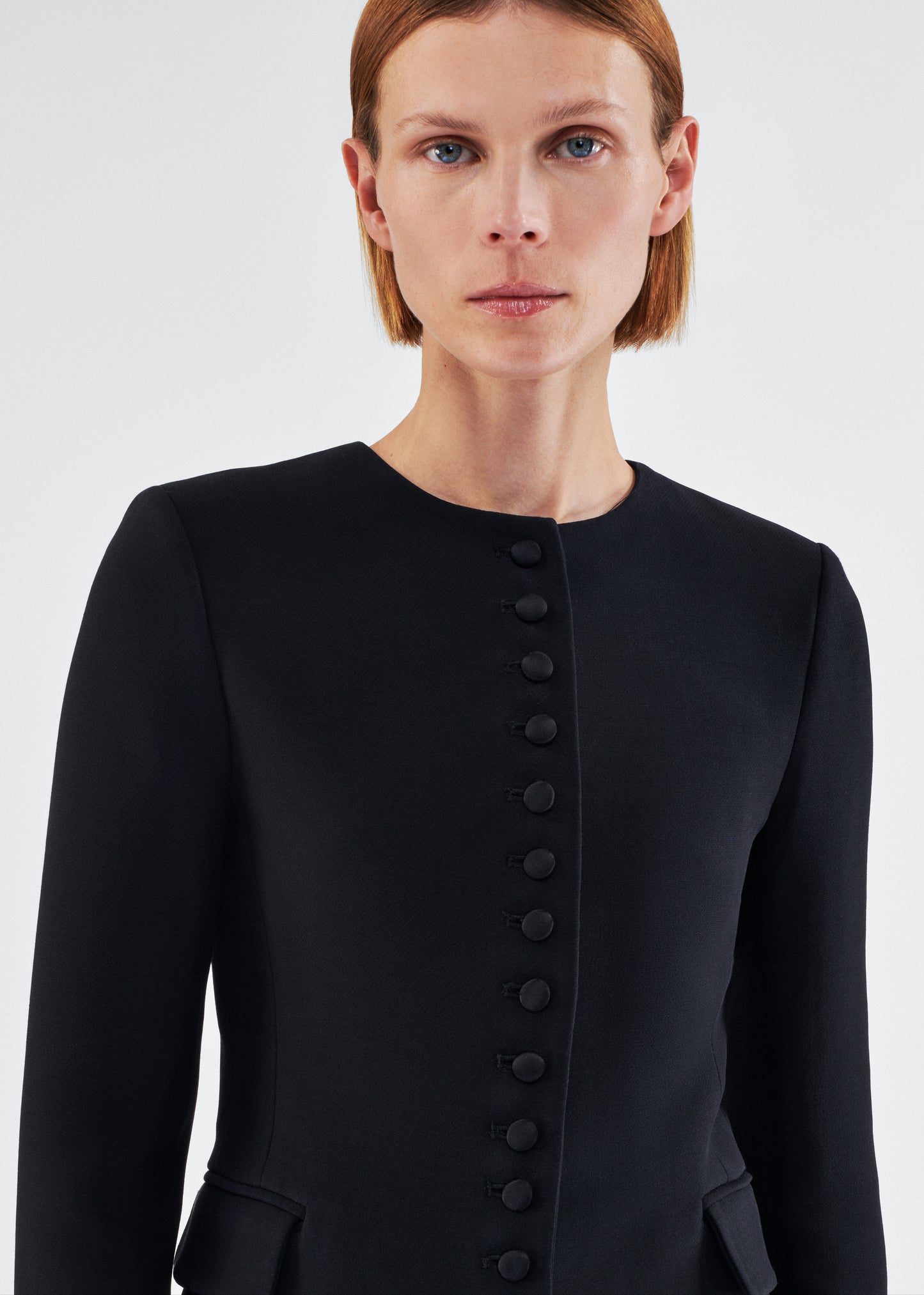 Close up of model wearing the Marin Jacket in Silk Wool in Black