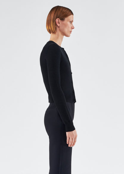 side view of model wearing the adam lippes cardigan in cashmere silk in black