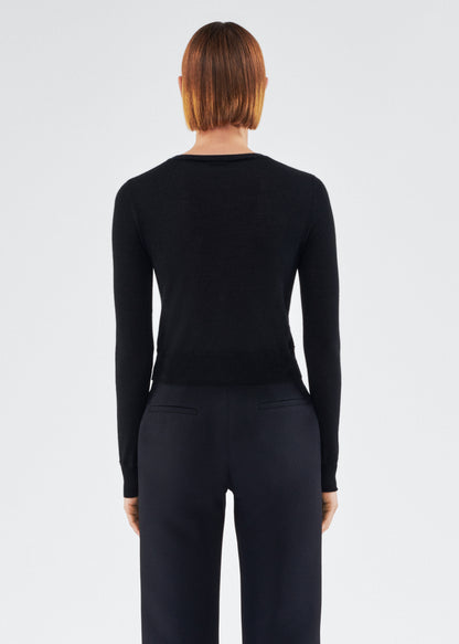 back view of model wearing the adam lippes cardigan in cashmere silk in black