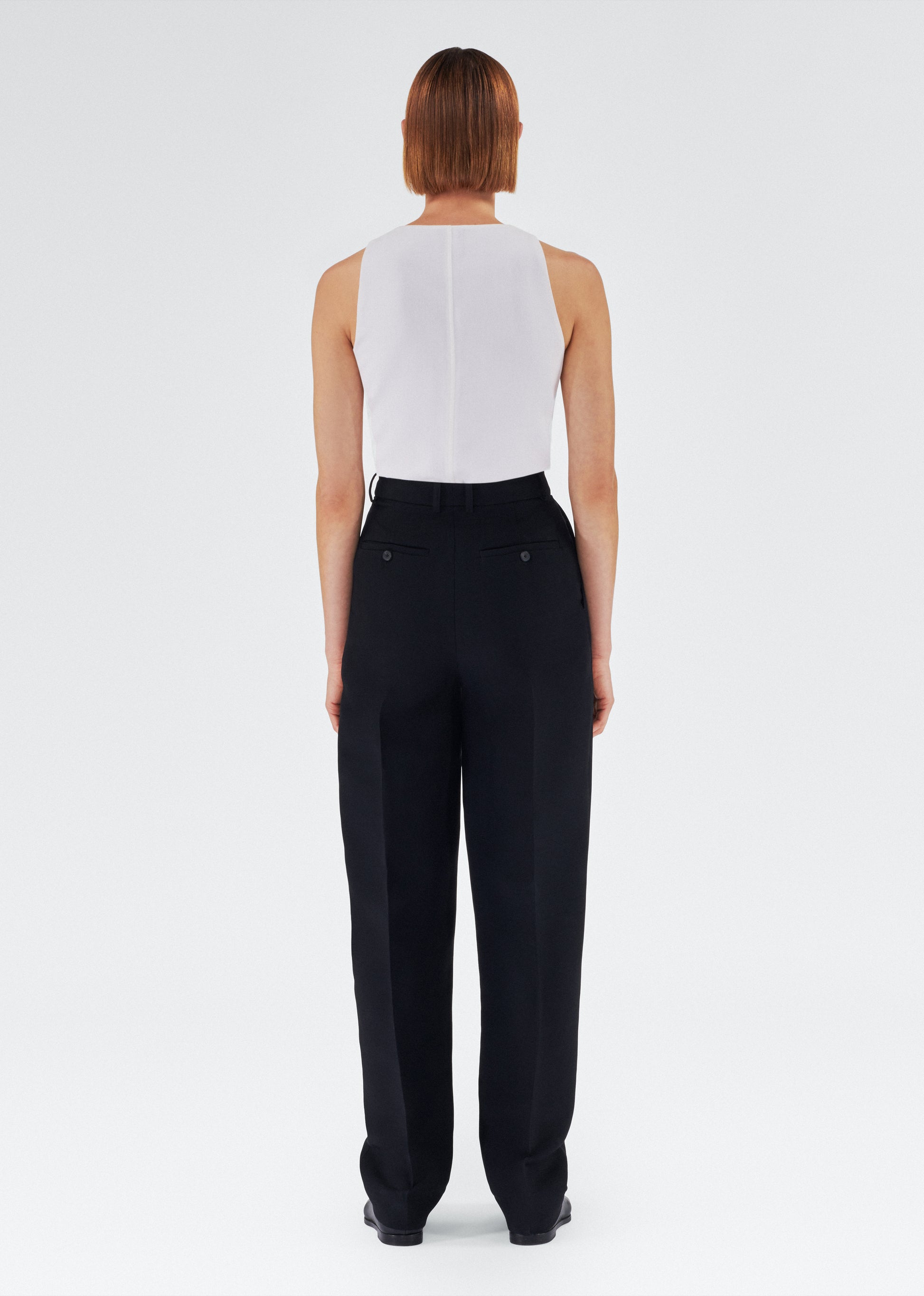 Back of model wearing the Nichols Pant in Silk Wool in Black