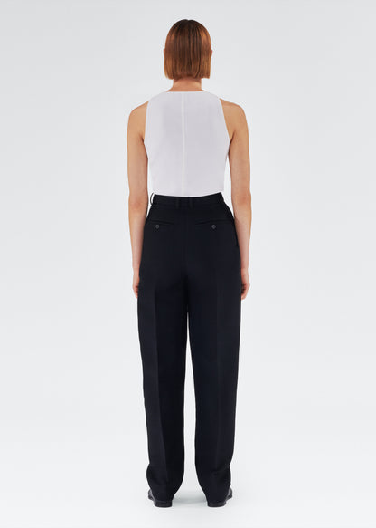 Back of model wearing the Nichols Pant in Silk Wool in Black