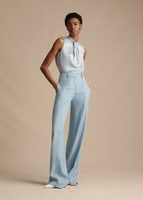 A model wearing the Full Leg Trouser in Stretch Canvas Styled with the Draped Neck Shell in Silk Charmeuse.