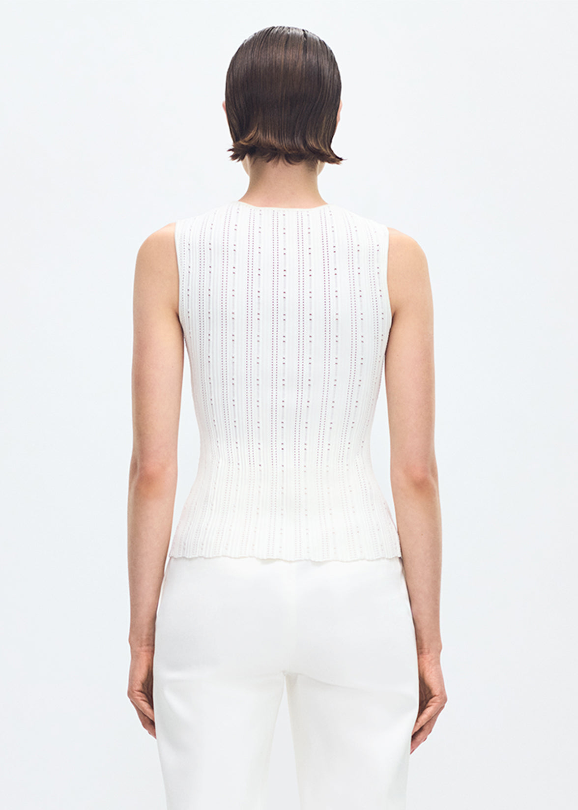 back profile of model wearing the brynn top in compact jacquard ivory