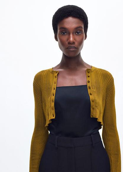 close up of model wearing the Glynis Cardigan in Silk Engineered Rib in Bronze