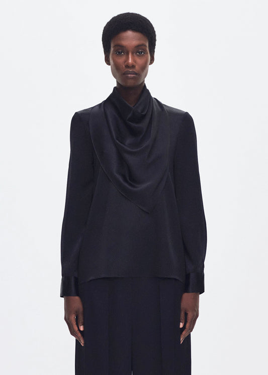 front profile of model wearing the bandera blouse in silk in black