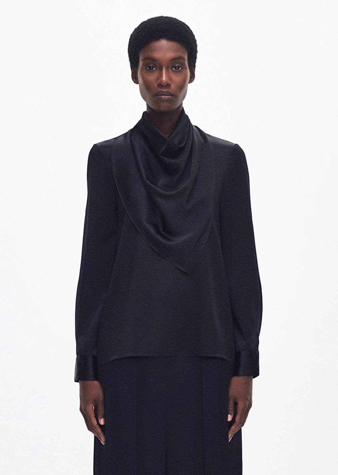 front profile of model wearing the bandera blouse in silk in black