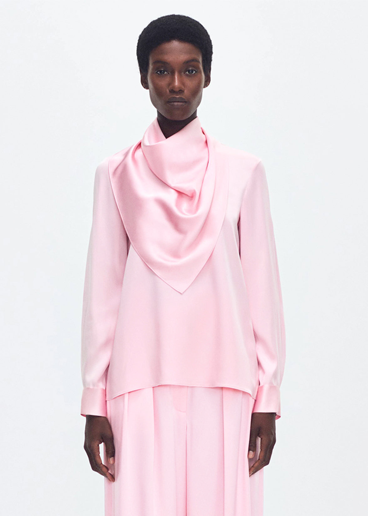 Model wearing the Bandera Blouse in Silk Charmeuse in Pink 