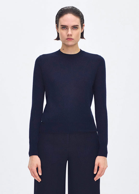 front profile of model wearing the didion knit in navy