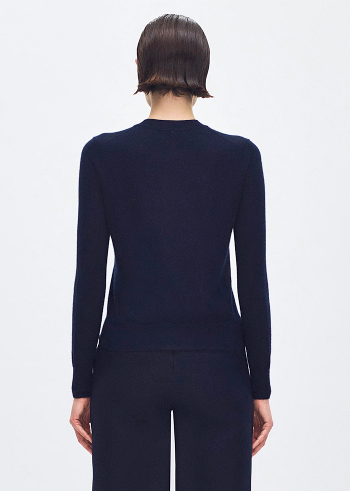 back profile of model wearing the didion knit in navy