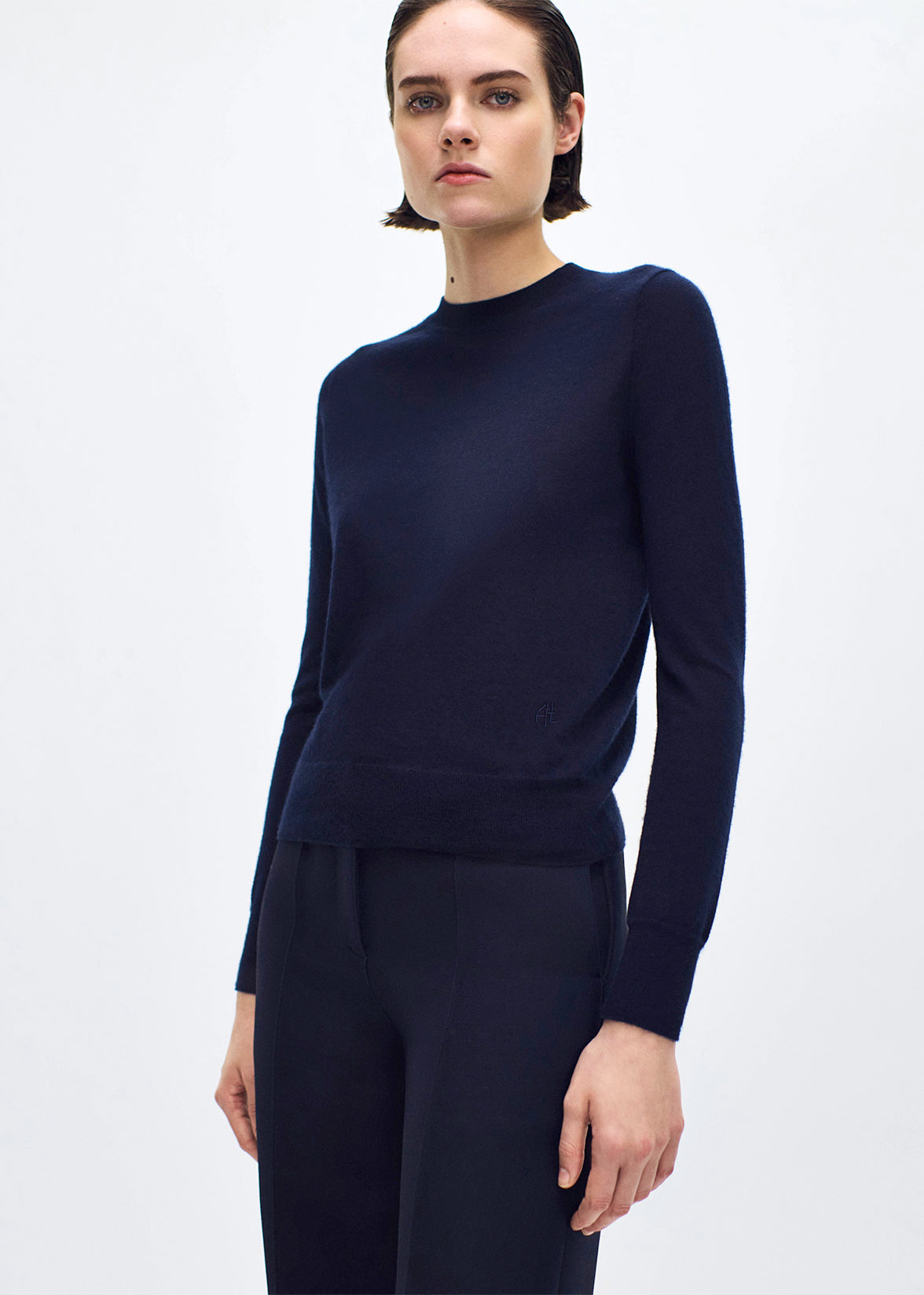 close up of model wearing the didion knit in navy