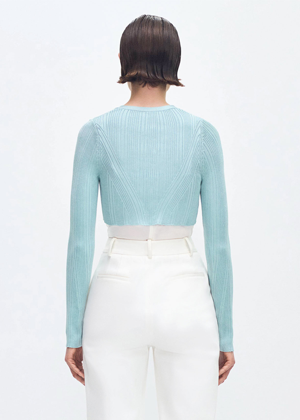 back profile of model wearing the Glynis Cardigan in Mist