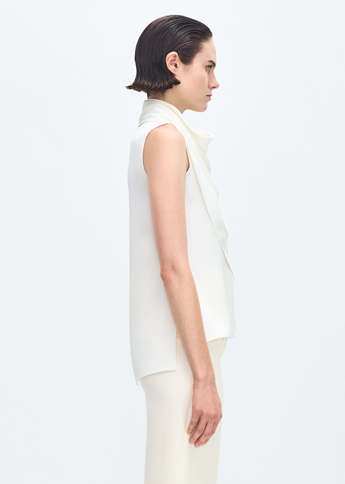 side profile of model wearing the Bandera Shell in Silk Crepe in Ivory