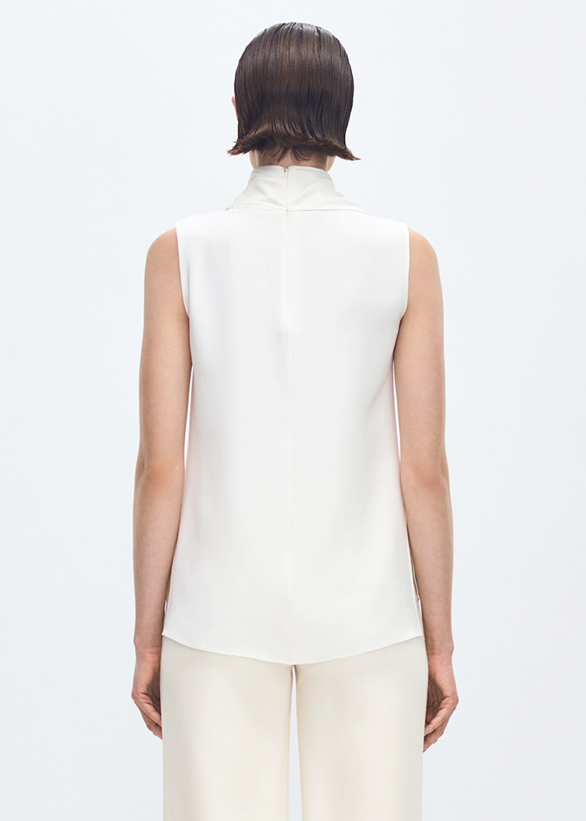 back profile of model wearing the Bandera Shell in Silk Crepe in Ivory