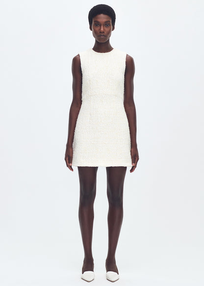 front full body profile of model wearing the tati dress in tweed in ivory