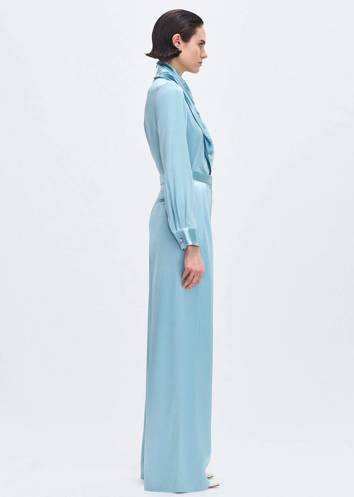 model wearing the Nils Pant in Silk Charmeuse in Mist with the bandera blouse in mist