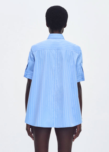 model wearing the trapeze shirt in stripe poplin in pale blue 