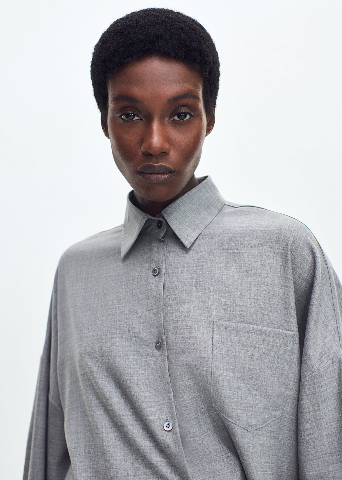 Close up of model wearing the Perrine Shirt in Fine Cashmere Suiting in Grey