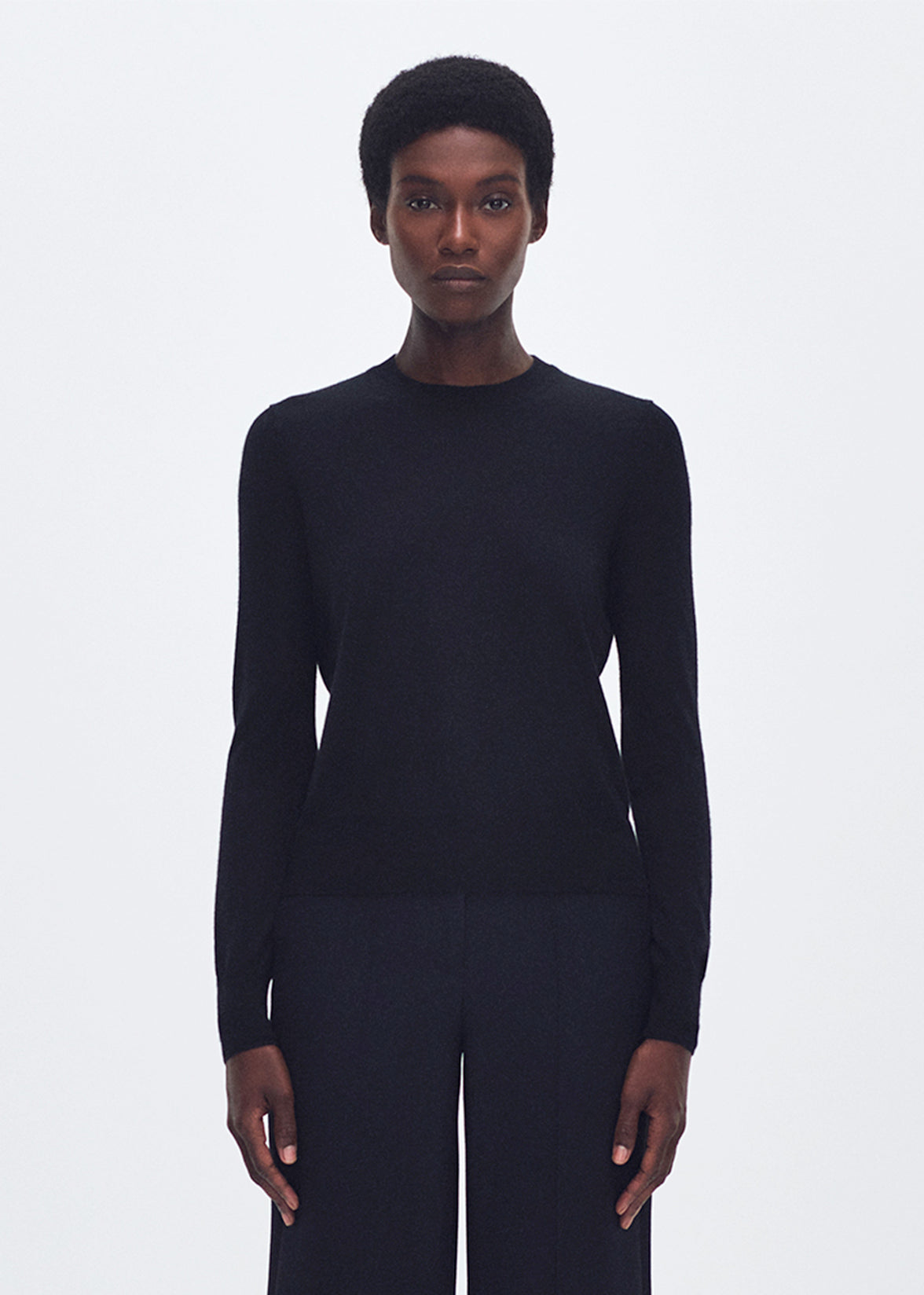 front profile of model wearing the Didion Knit in Cashmere in black