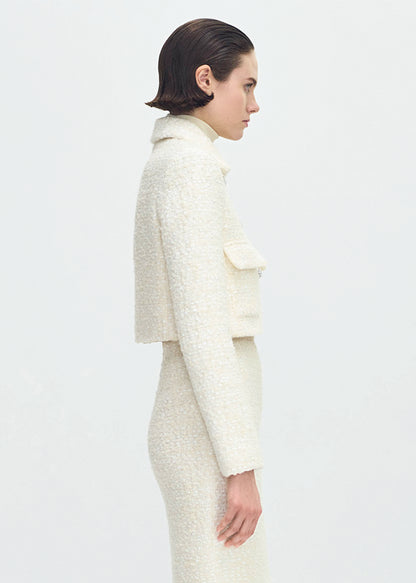 side profile of model wearing the cecil jacket in tweed in ivory