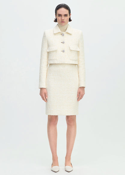 front full body profile of model wearing the cecil jacket in tweed in ivory