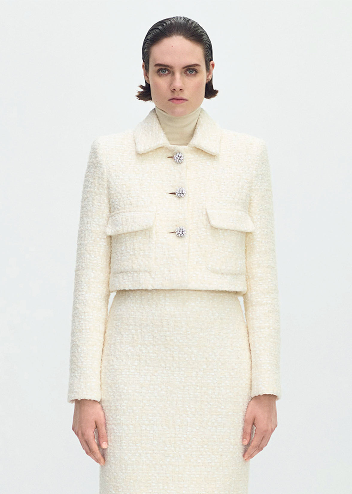 front profile of model wearing the cecil jacket in tweed in ivory