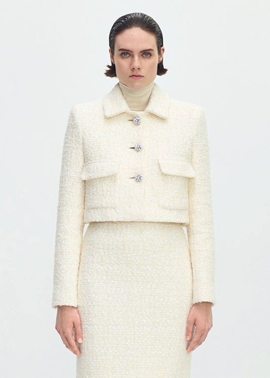 front profile of model wearing the cecil jacket in tweed in ivory