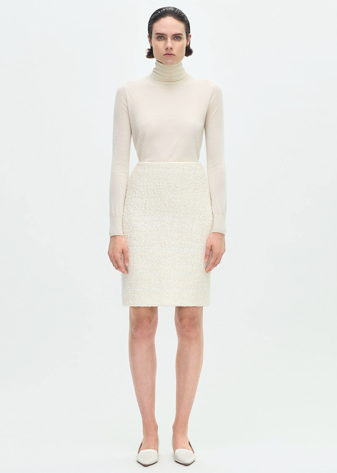 front profile of model wearing the Blair Skirt in Tweed in Ivory