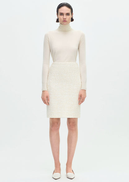 front profile of model wearing the Blair Skirt in Tweed in Ivory