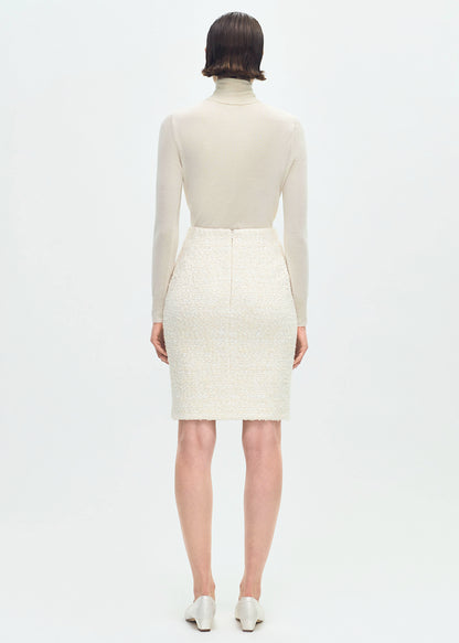 back profile of model wearing the Blair Skirt in Tweed in Ivory