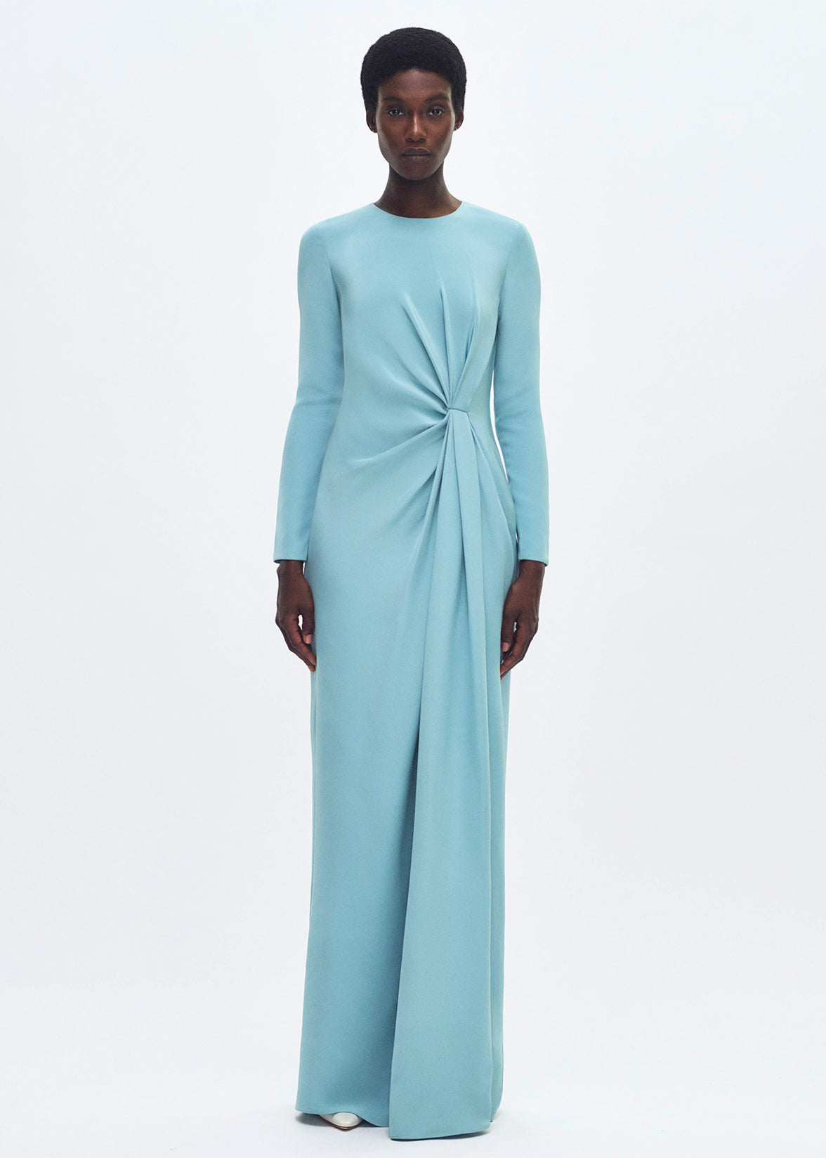 front profile of model wearing the long draped dress in silk crepe in mist