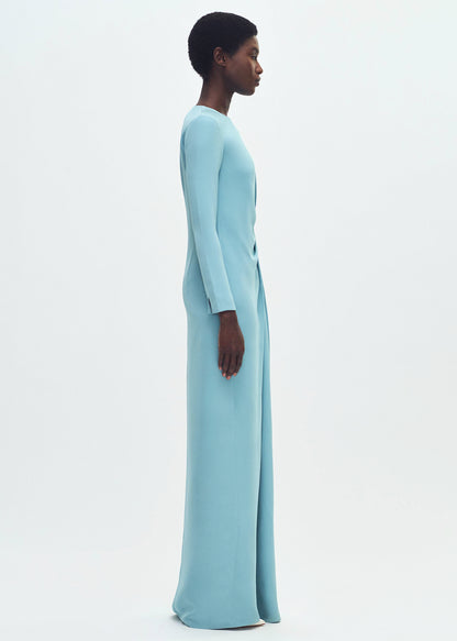 side profile of model wearing the long draped dress in silk crepe in mist