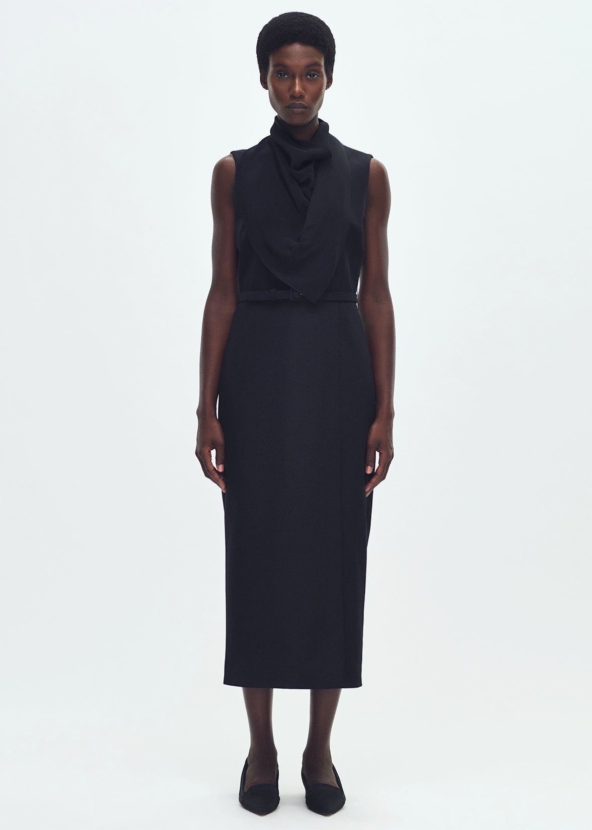 Front profile of model wearing THE BANDERA DRESS IN SILK CREPE IN
BLACK