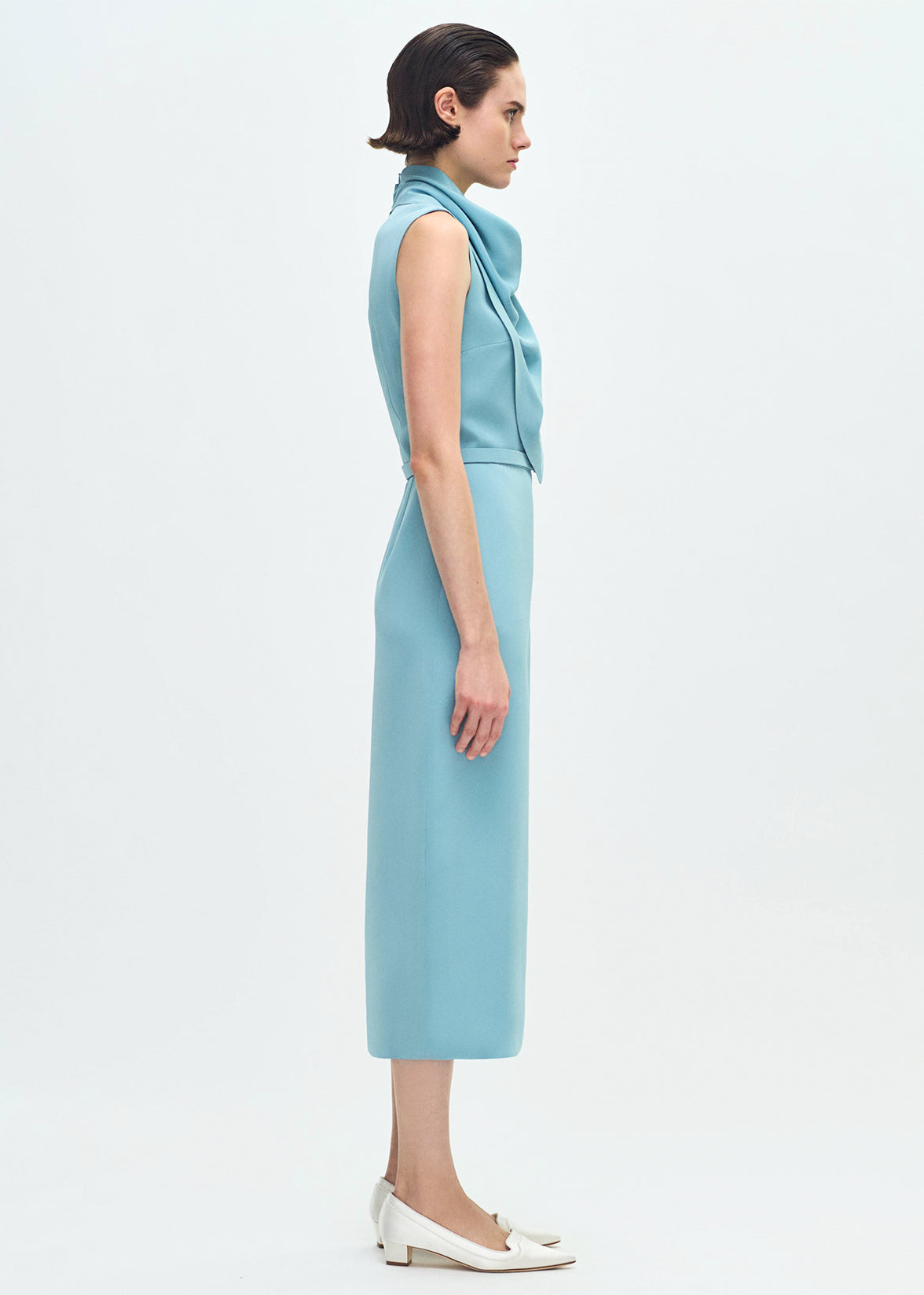 side profile of model wearing the Bandera Dress in Silk Crepe in Mist