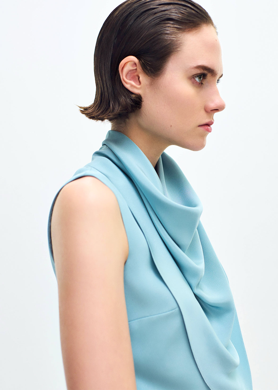 close up profile of model wearing the Bandera Dress in Silk Crepe in Mist