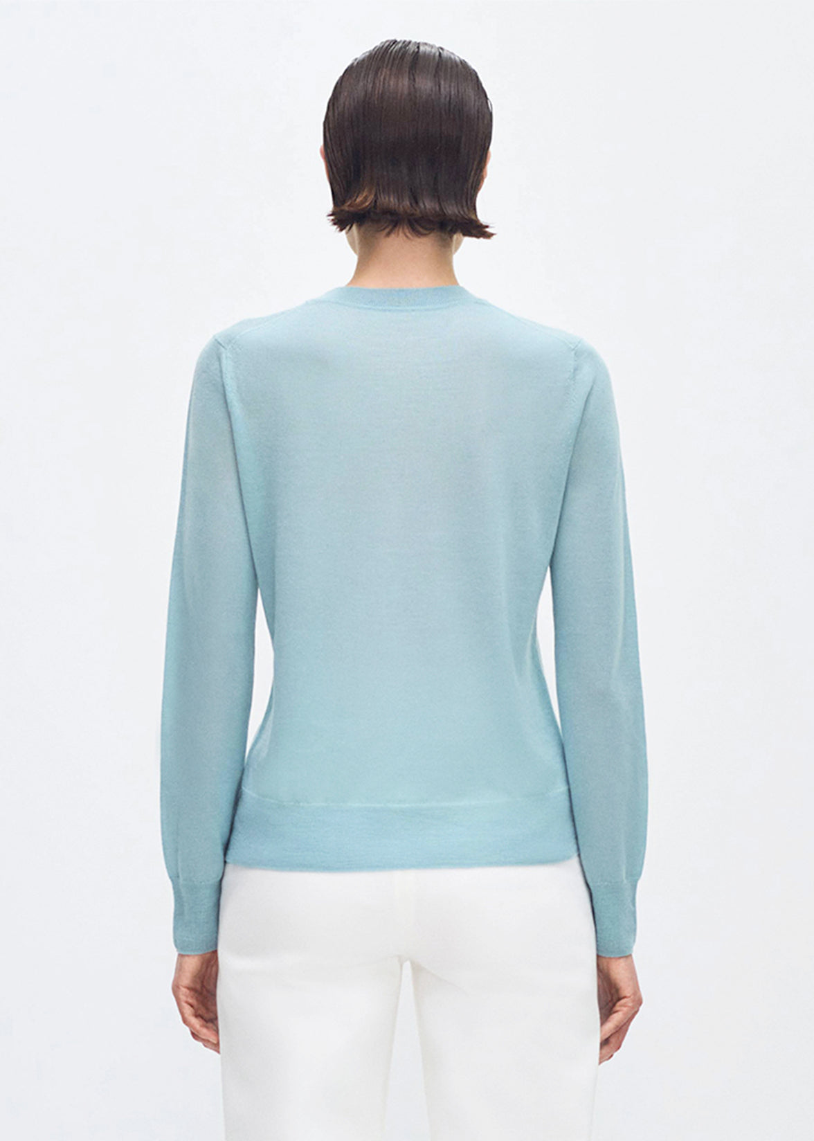 Back profile of model wearing the Didion Knit in cashmere silk in mist