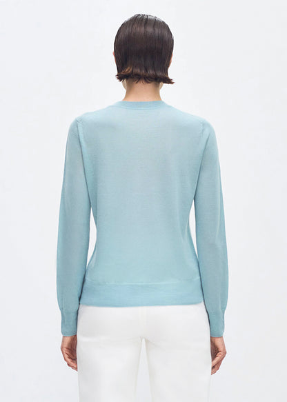 Back profile of model wearing the Didion Knit in cashmere silk in mist