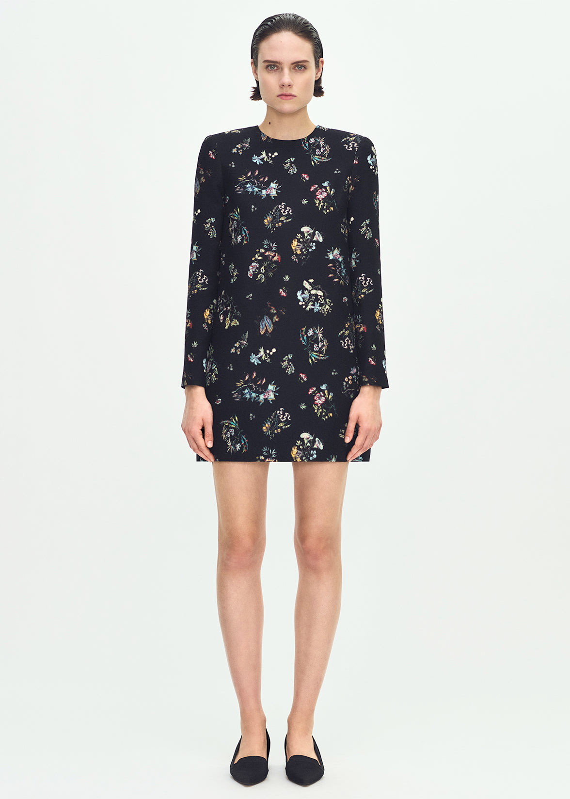 front profile of model wearing the Tilley dress in black floral