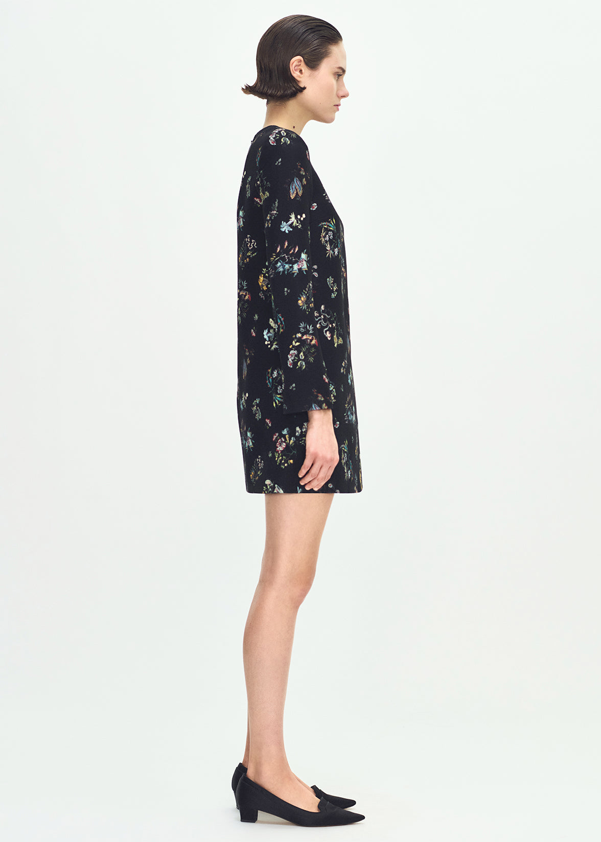 side profile of model wearing the Tilley dress in black floral