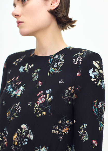 close up profile of model wearing the Tilley dress in black floral