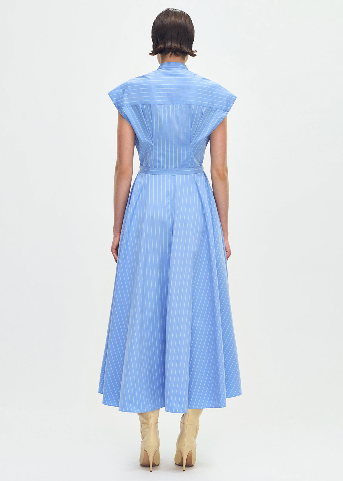 model wearing the Dejeuner Dress in Stripe Poplin in blue